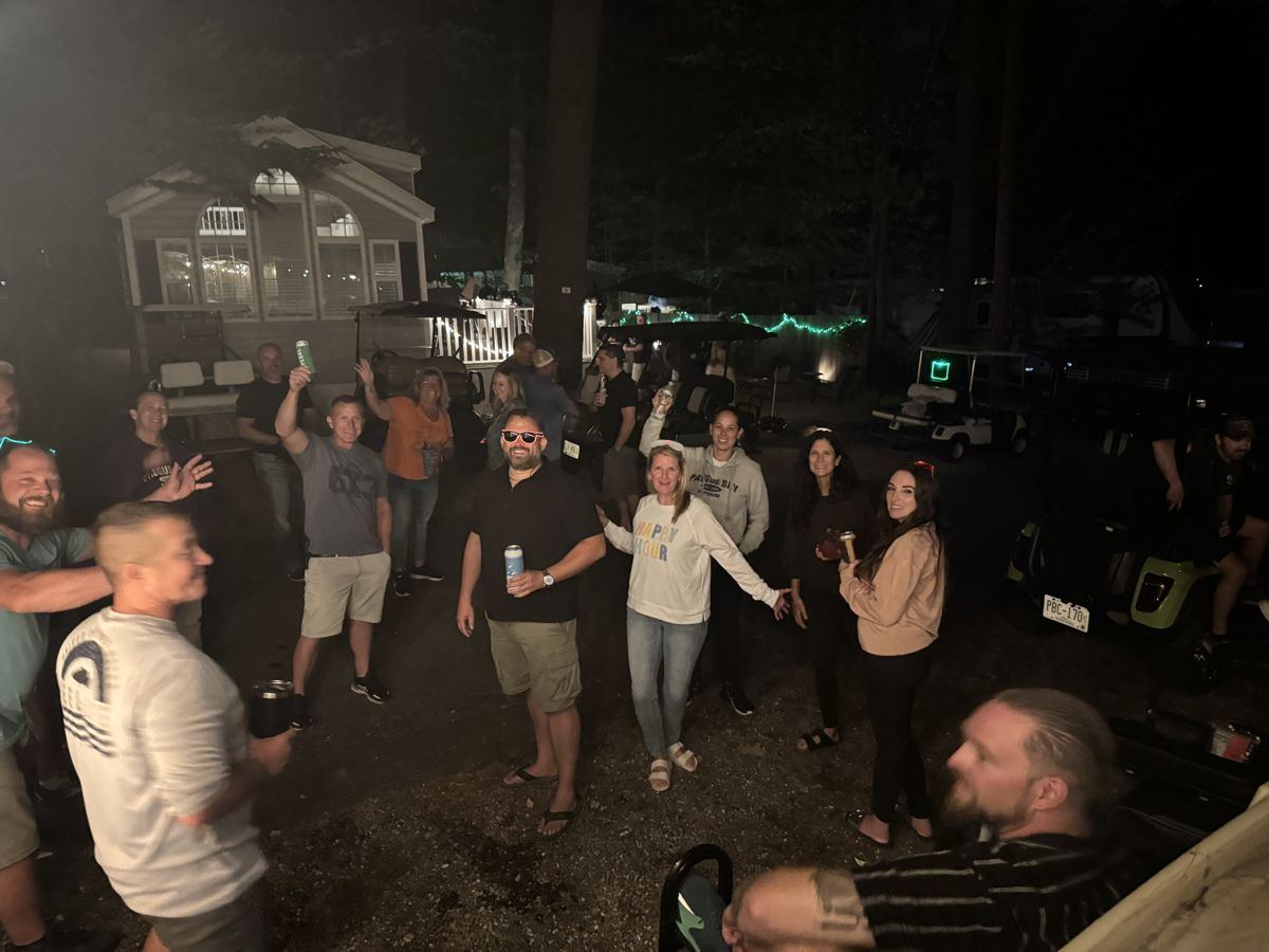 Friends partying at night at the Paugus Bay campground